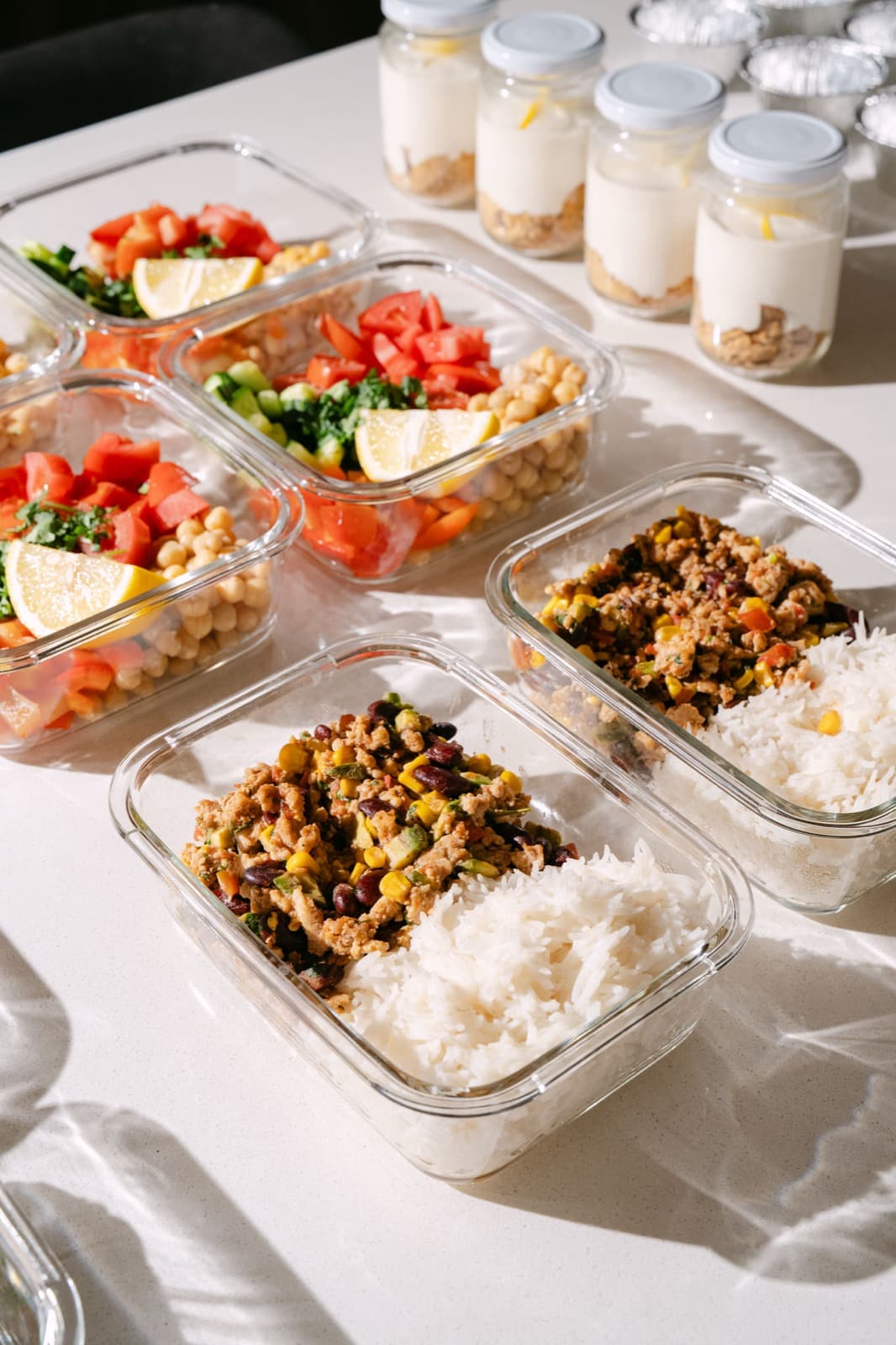 Professional meal prep containers with fresh meals